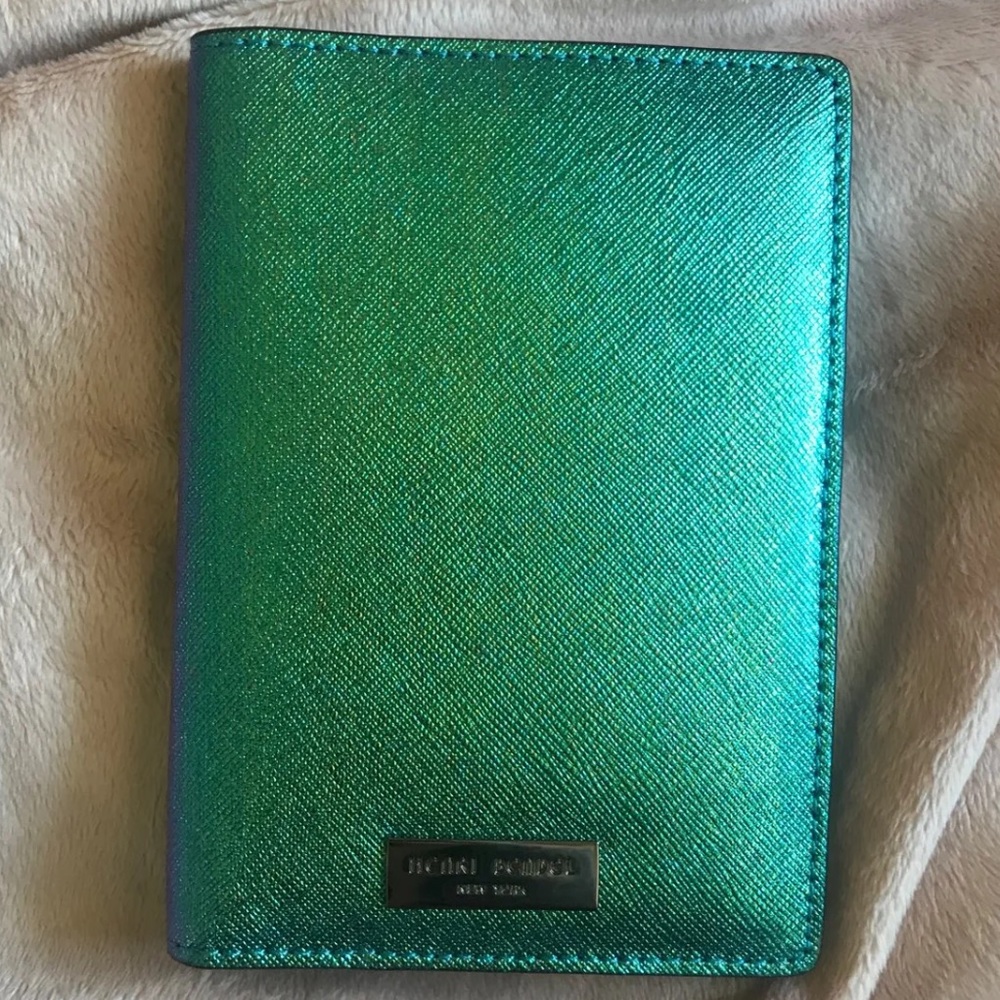 Looking to buy Henri Bendel Passport in Petrol